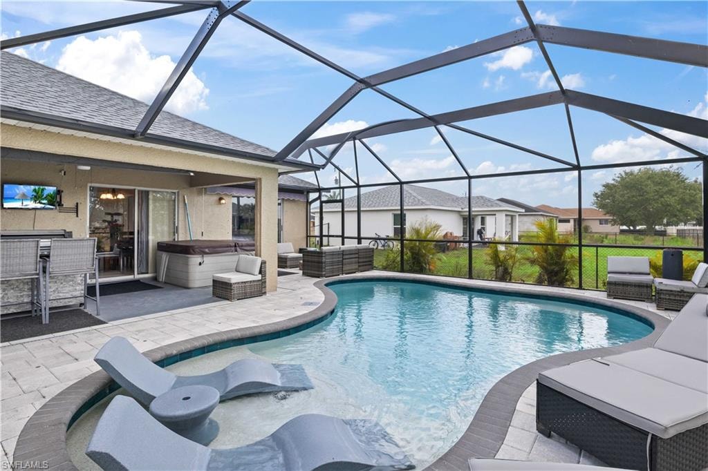 The seamless flow between the pool, spa, and outdoor living spaces creates an inviting, luxurious atmosphere.