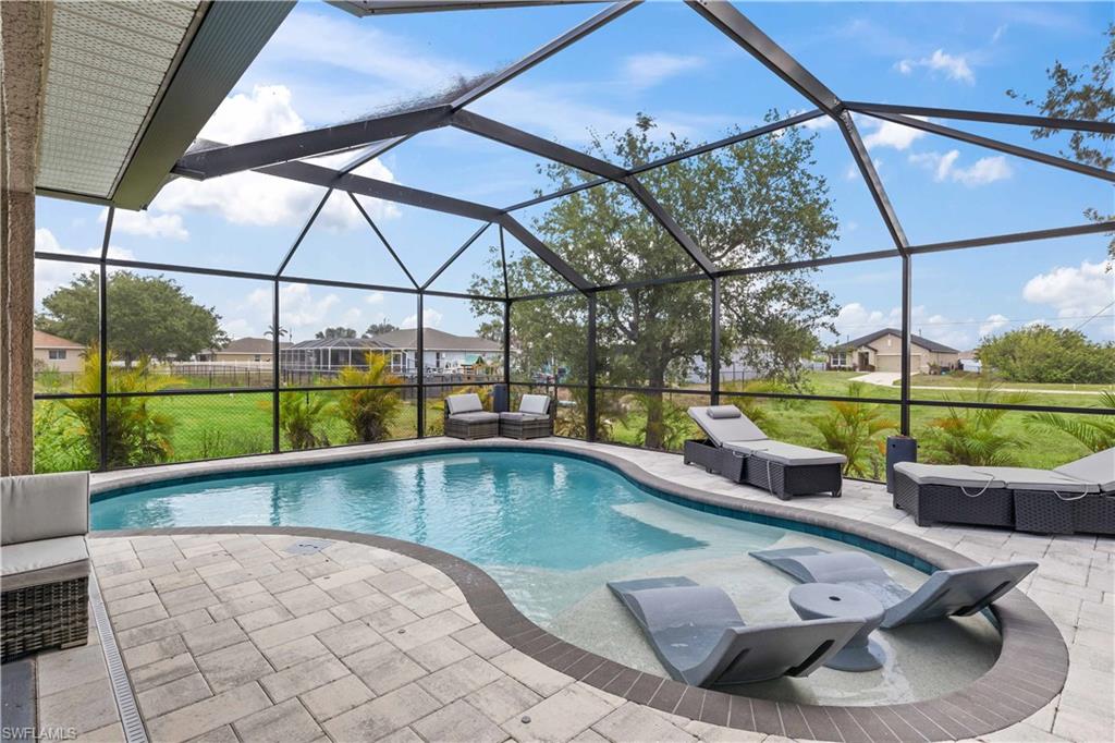 This stunning pool home boasts a sparkling pool, surrounded by lush landscaping and a spacious lanai, perfect for outdoor entertaining or relaxing in privacy.