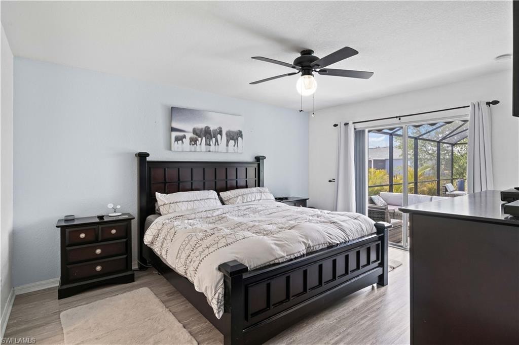 The primary bedroom offers easy access to the spa through sliding glass doors, allowing you to step directly into your private outdoor retreat.