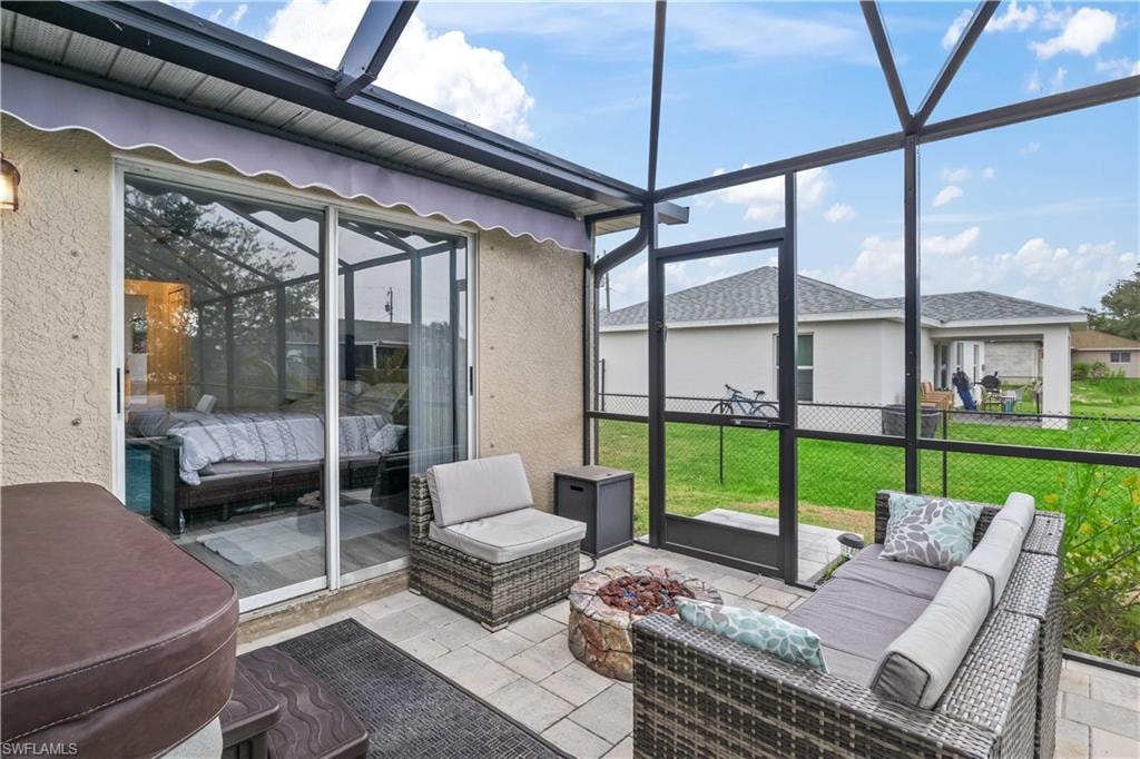 The space is beautifully complemented by a cozy fire pit, surrounded by comfortable seating, offering a perfect spot to unwind or gather with friends and family in the evening.