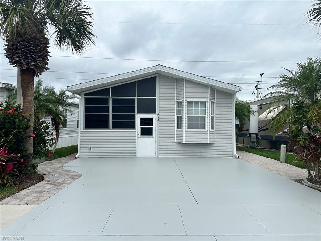 View of front of property with a sunroom