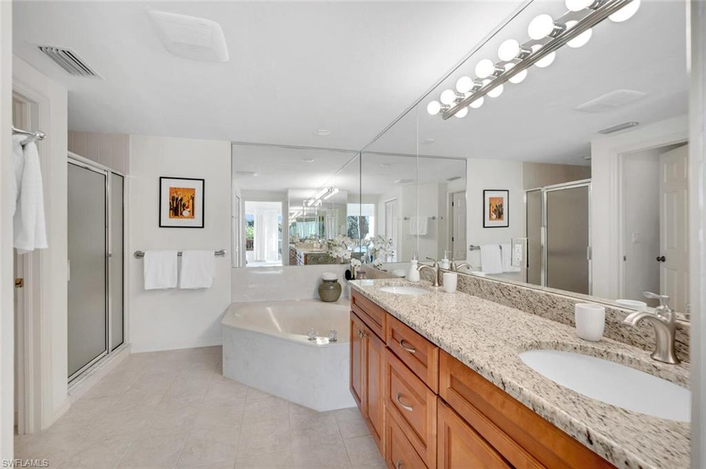 Primary Bathroom. Dual sinks and tastefully updated.