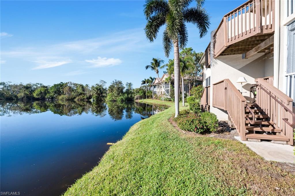 Back of home looking at water and deck