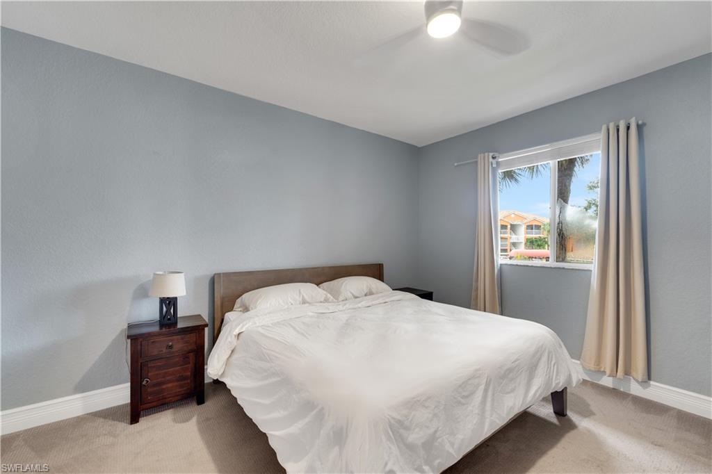 Bedroom with carpet flooring and a ceiling fan