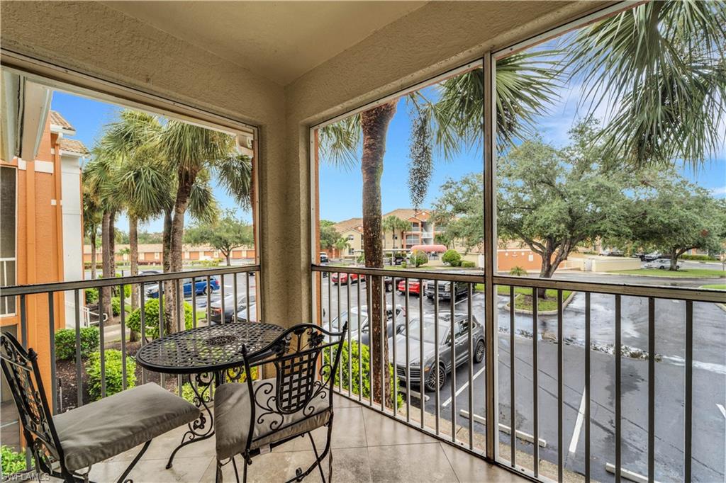 Balcony featuring a sunroom