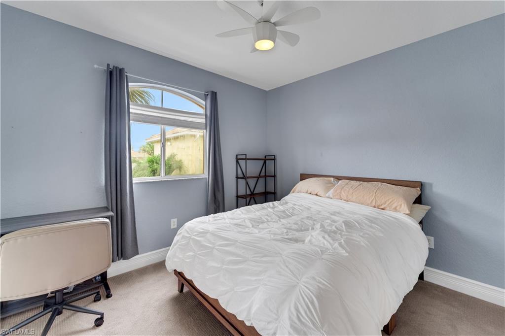 Bedroom with carpet flooring and a ceiling fan