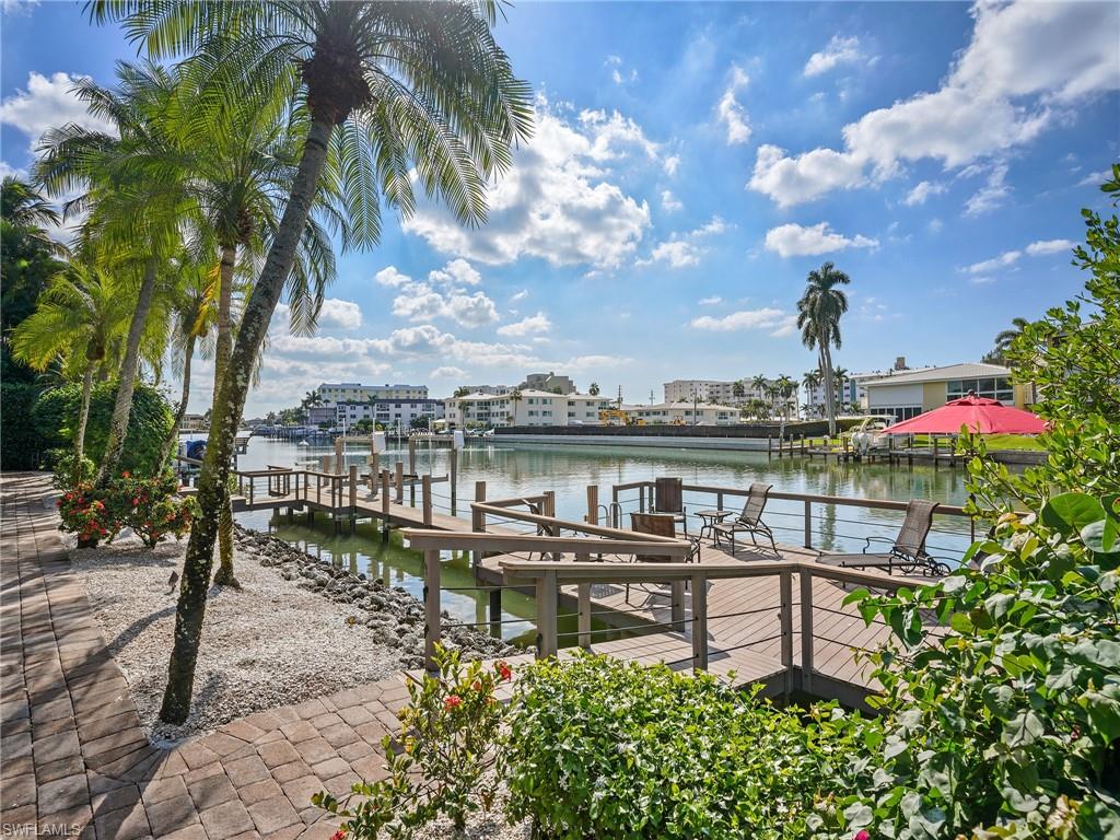 Dock with boat lift and a water view