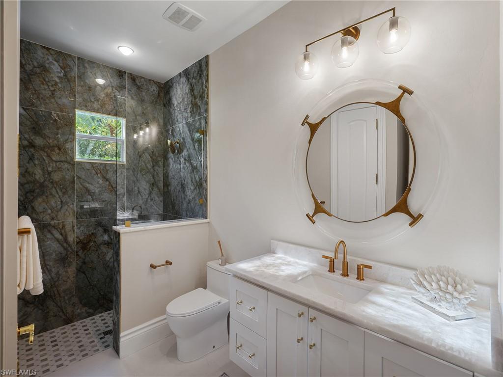 Bathroom with a walk in shower and vanity