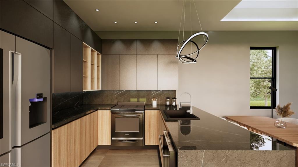 Kitchen with stainless steel appliances, hanging light fixtures, a peninsula, dark stone countertops, and tasteful backsplash