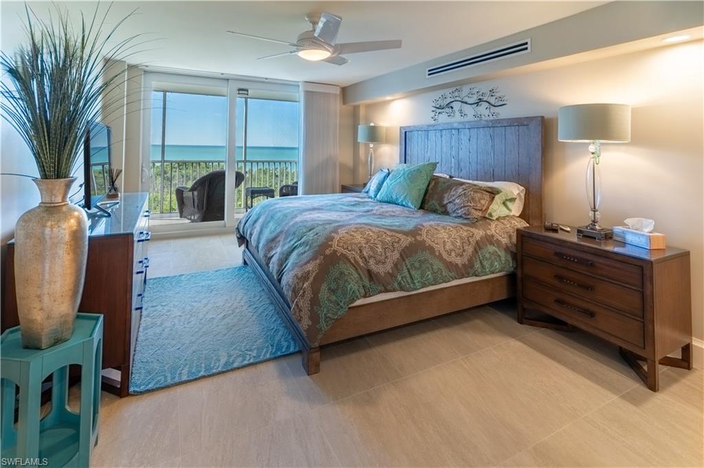 Bedroom featuring access to outside and a ceiling fan