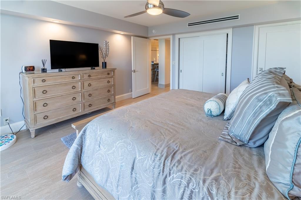 Bedroom featuring a ceiling fan and baseboards