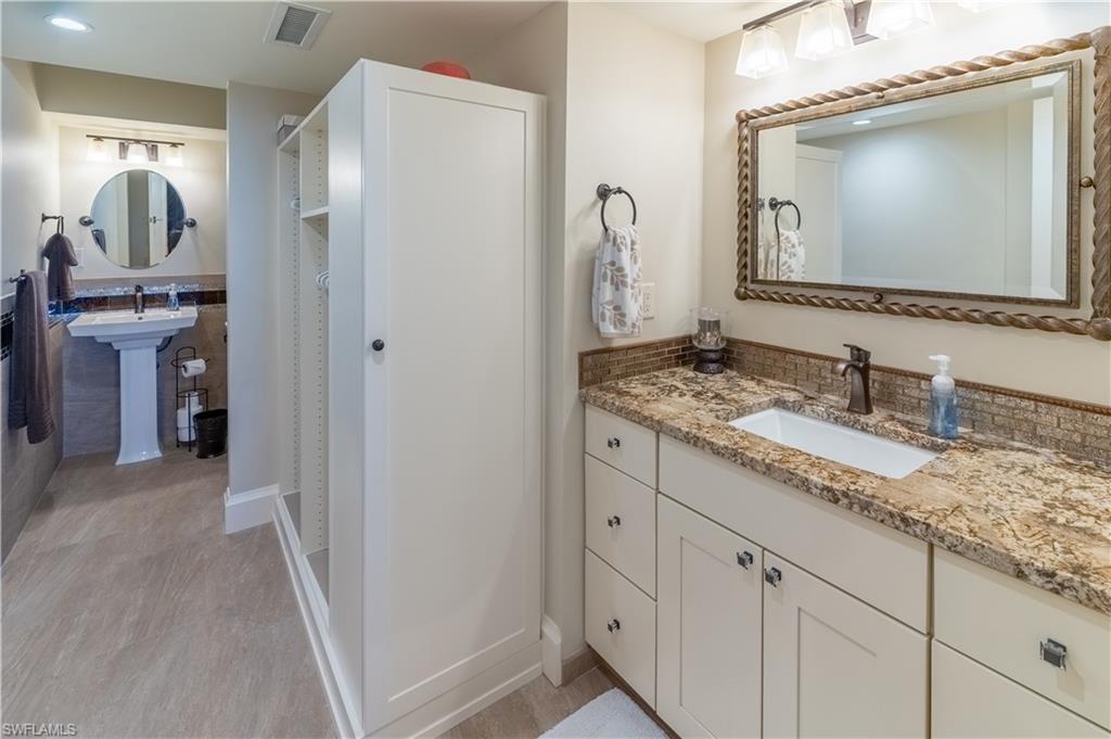 Bathroom featuring baseboards and vanity