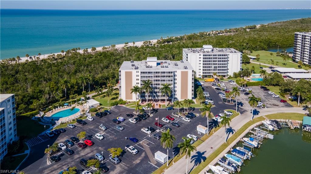 Aerial view of a large body of water and apartment complex / building