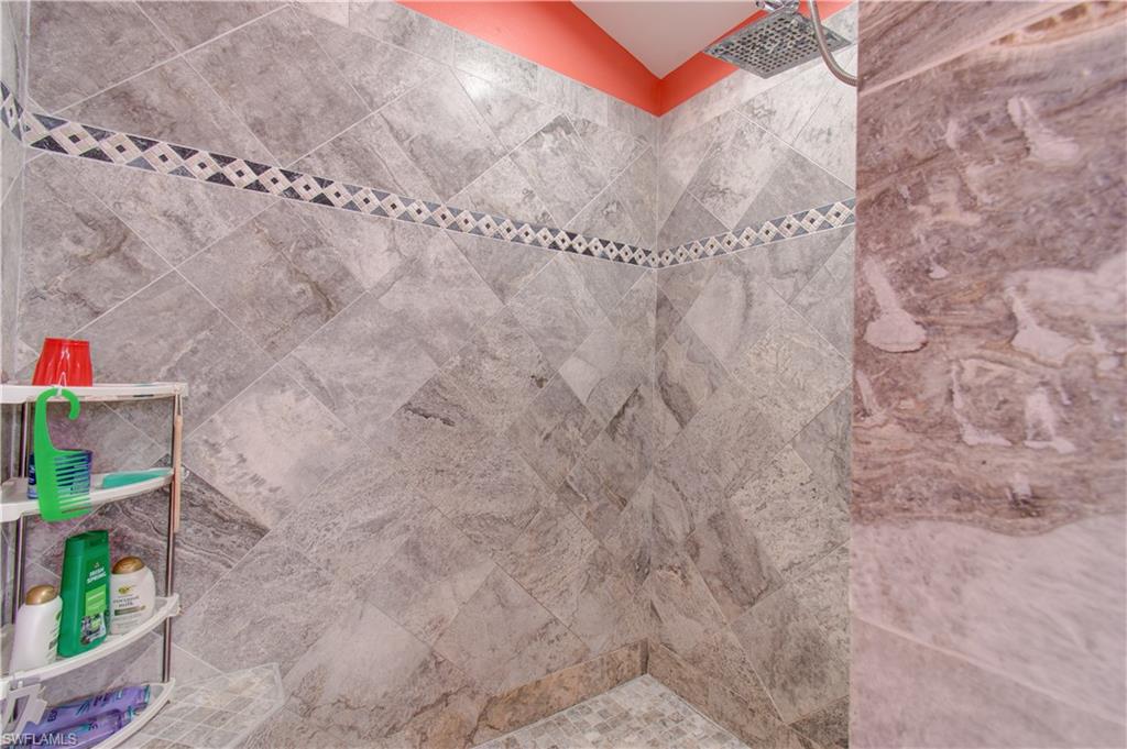 Bathroom view of a tile shower