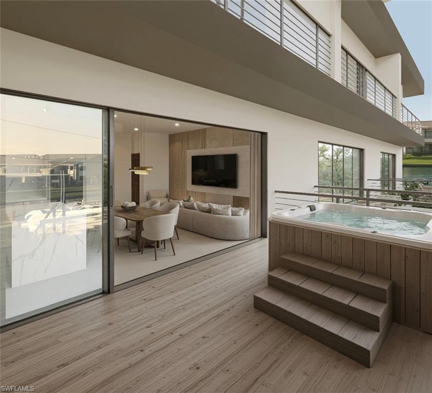 Wooden terrace with a hot tub