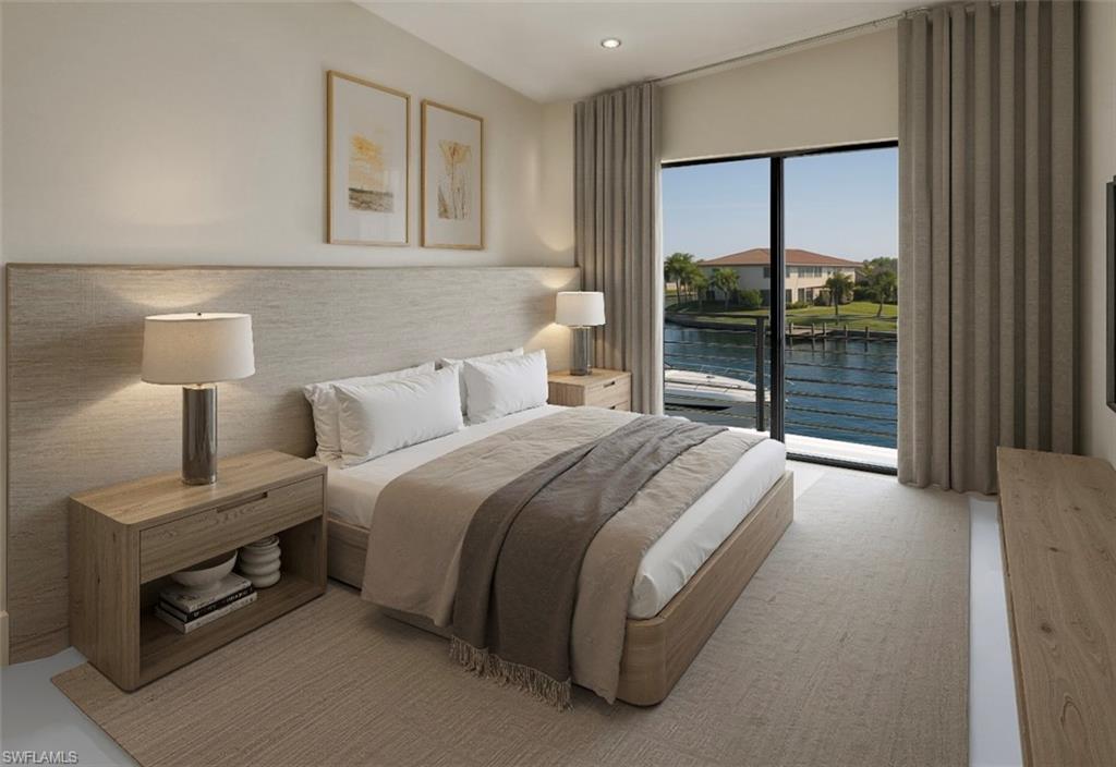 Bedroom with a water view, access to outside, and recessed lighting