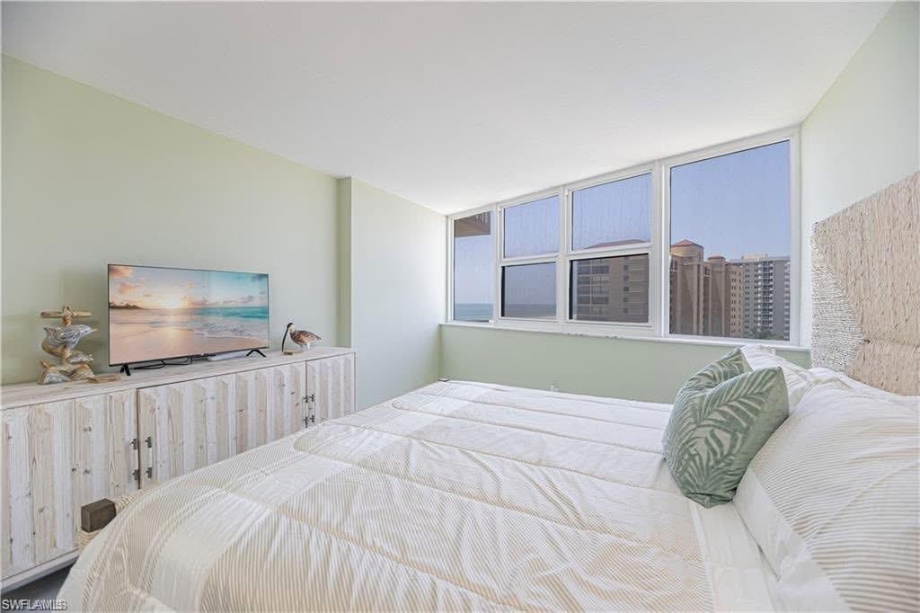 View of spacious primary bedroom overlooking the Gulf