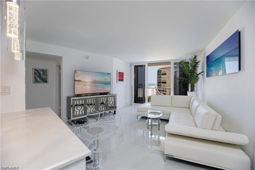 Living room offers beach views from living area, bedrooms, balcony