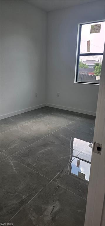 Spare room with baseboards