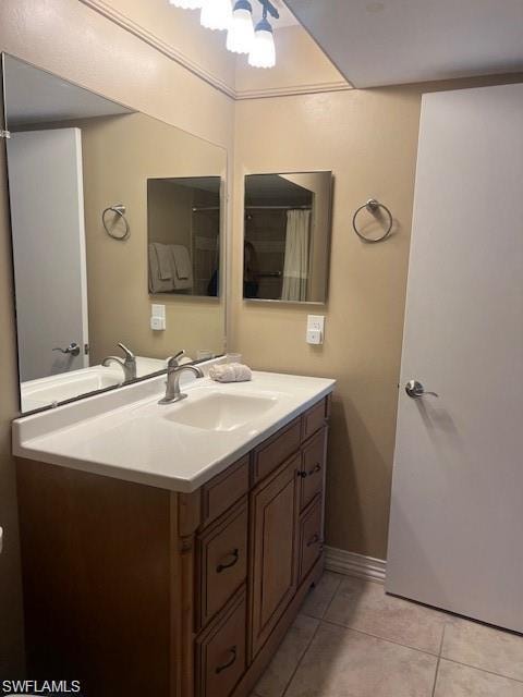 Bathroom featuring vanity and light tile patterned flooring