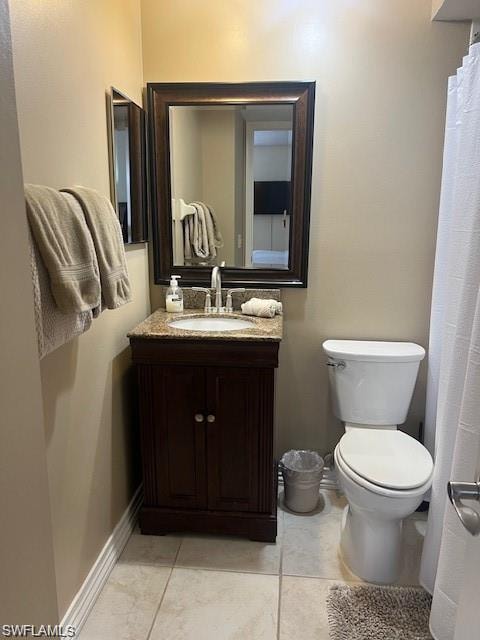 Full bathroom featuring curtained shower, vanity, and light tile patterned flooring