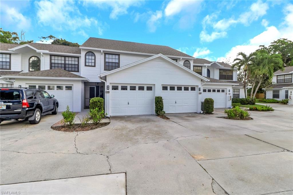 Traditional-style home with driveway and a garage