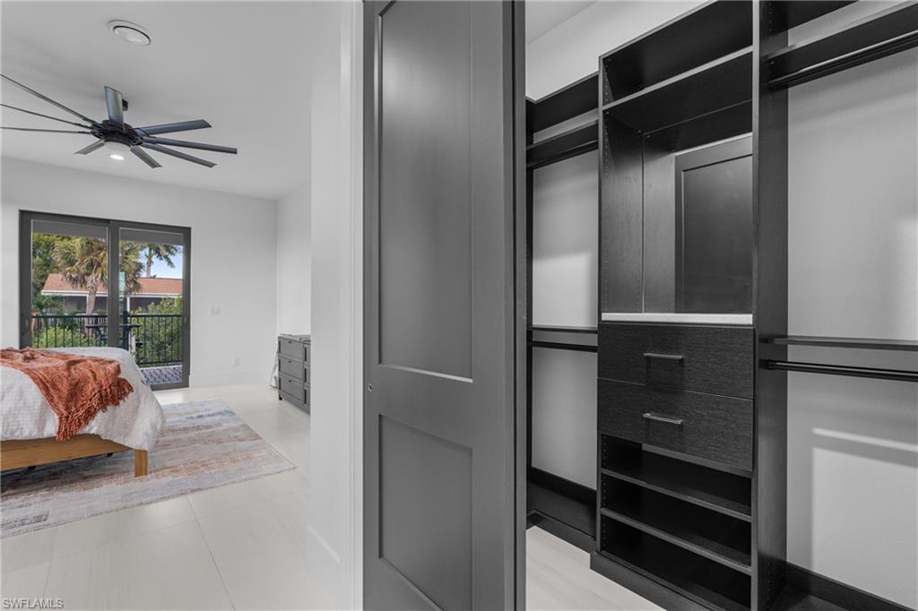 Bedroom with access to outside, recessed lighting, and a ceiling fan