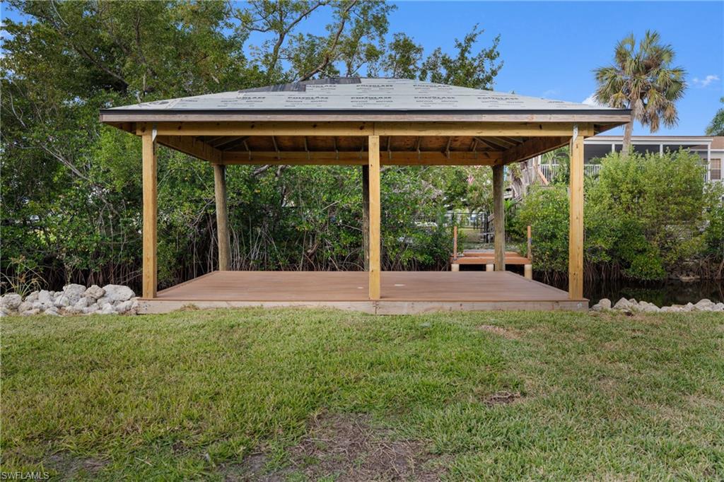 View of grassy yard featuring a gazebo