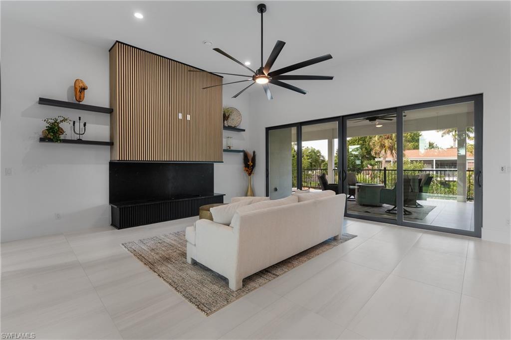 Living area featuring a ceiling fan and recessed lighting