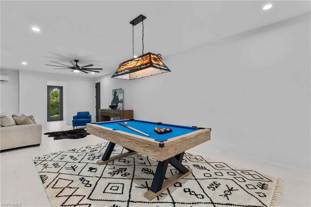 Recreation room with recessed lighting, pool table, and ceiling fan