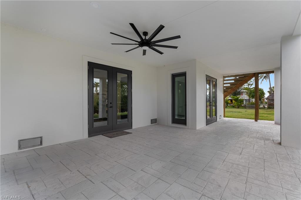 View of patio / terrace with french doors and ceiling fan