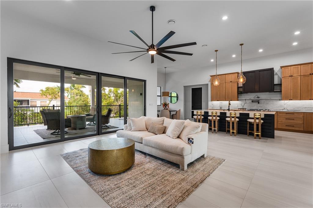 Living room featuring recessed lighting and ceiling fan