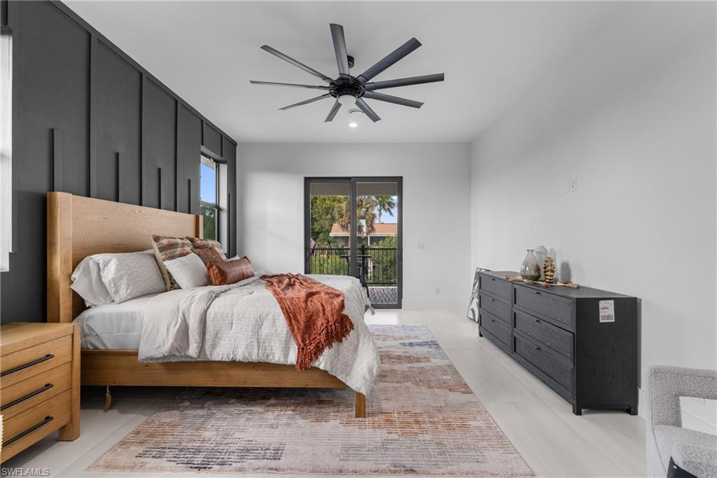 Bedroom with access to outside, ceiling fan, and recessed lighting