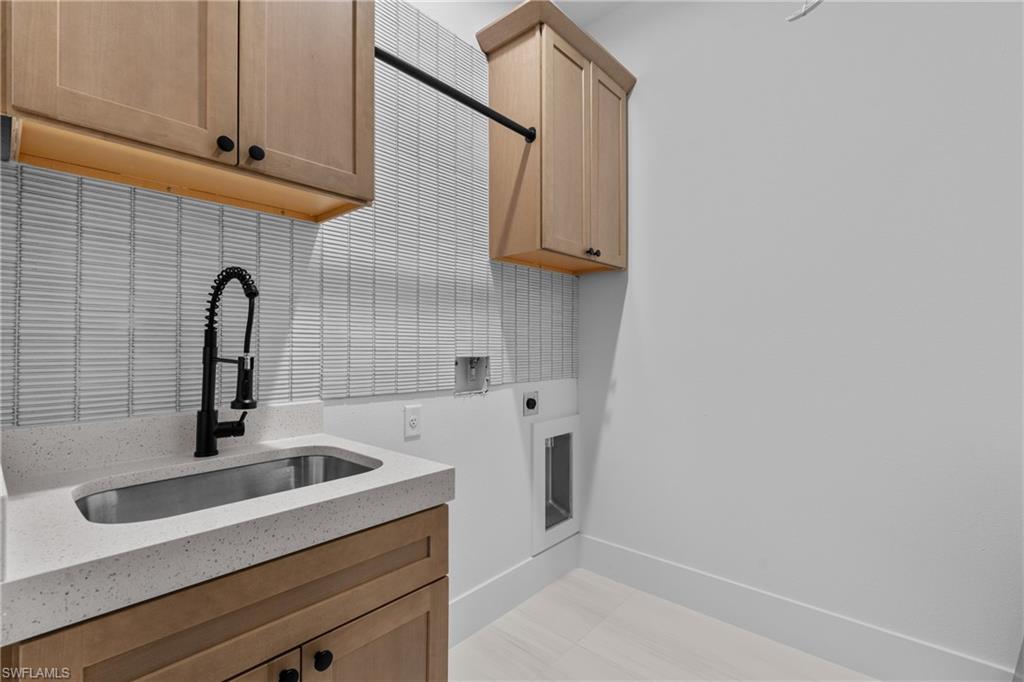 Laundry room with cabinet space and electric dryer hookup