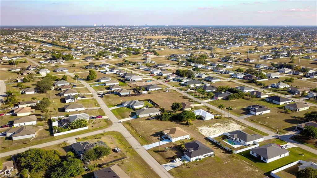 Aerial overview of property's location with nearby suburban area