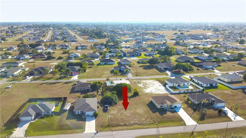 View of property location with nearby suburban area
