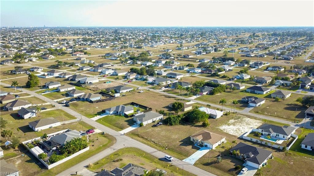 View of property location with nearby suburban area