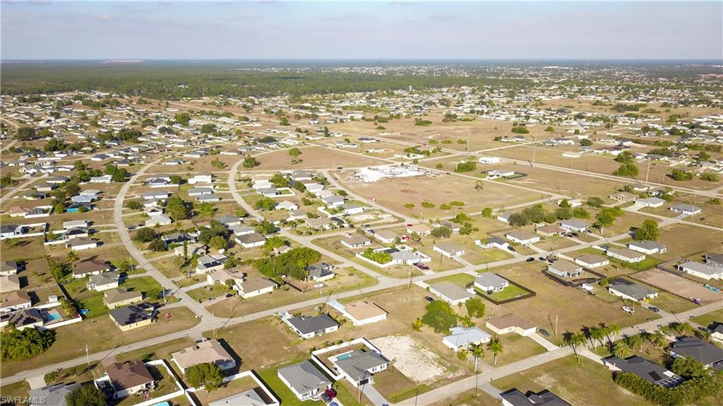 Aerial overview of property's location featuring nearby suburban area