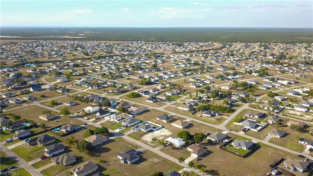 View of property location with nearby suburban area