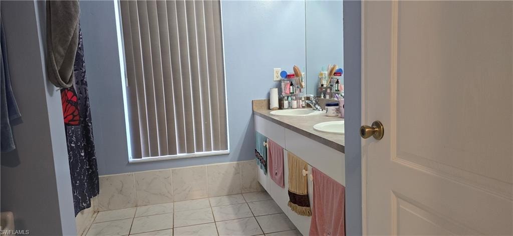 Bathroom featuring double vanity