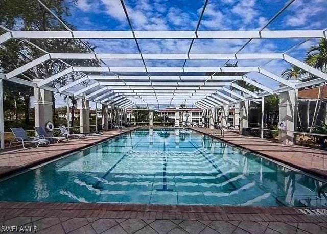 Community pool featuring a lanai and a patio