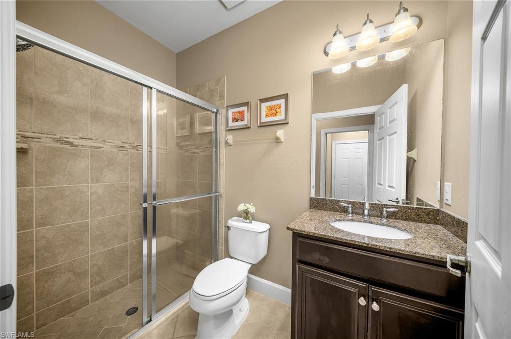 Guest bathroom features a walk-in shower.