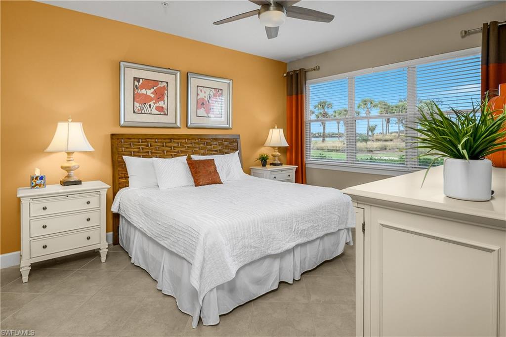 Primary bedroom is spacious with a wall filled with windows allowing natural light to spill in providing stunning views from morning to night.