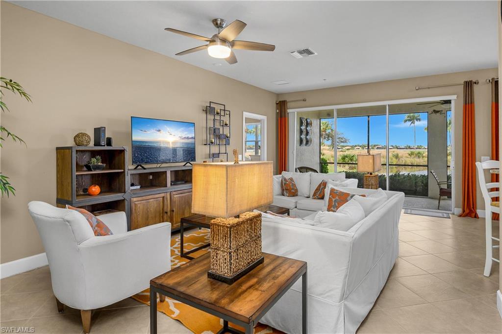 Great room with high ceilings, lots of natural light, and seamless indoor/outdoor living space.