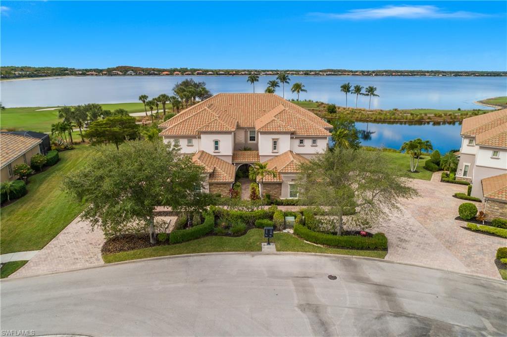 Spacious two car garage, first floor entry, oversized lanai, and stunning views from this turnkey unit... simply pack your suitcase and move in!