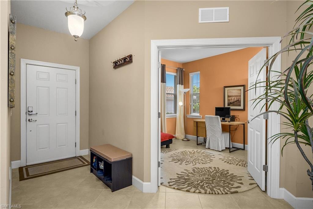 Open Foyer entry and french doors leading to den/office.