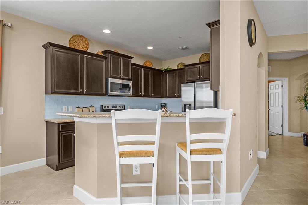 Open Kitchen with breakfast bar and family dining area for more formal meals.
