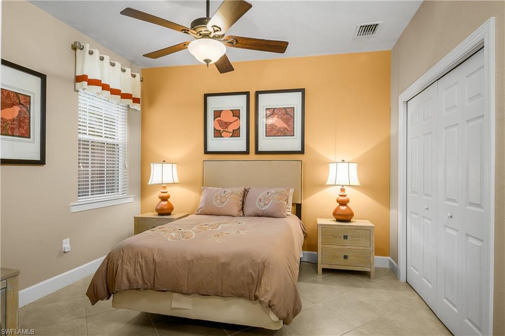 Guest bedroom is at the opposite side of the home giving guests their own private space and includes a dedicated bath nearby.
