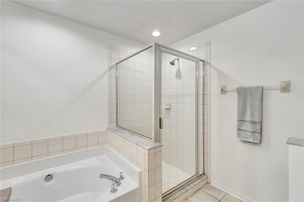Full bathroom with a stall shower, tile patterned flooring, a garden tub, and recessed lighting