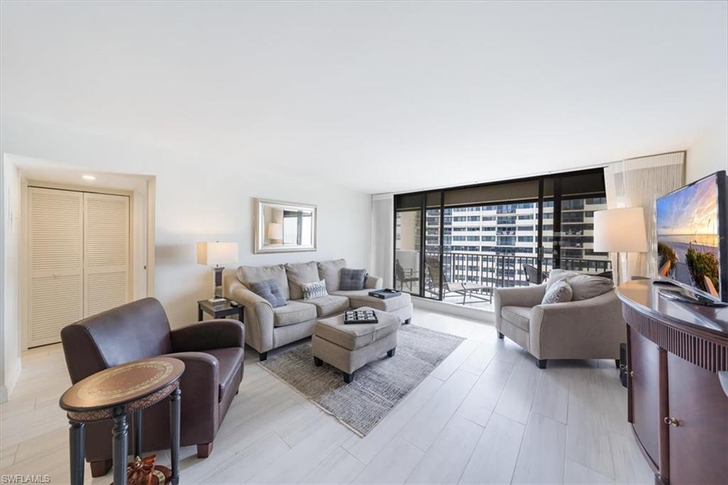 Living area featuring a wall of windows